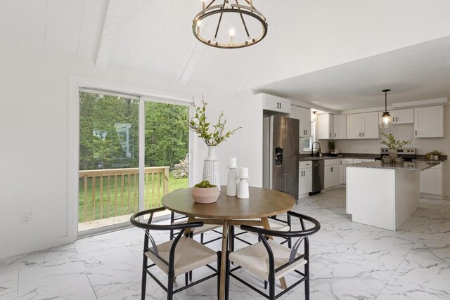133 Jean Dr, Seekonk, MA 02771 - dining area featuring light marble finish flooring, a chandelier, vaulted ceiling, and baseboards