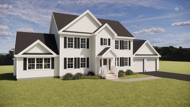 colonial inspired home featuring a garage, driveway, and a front yard