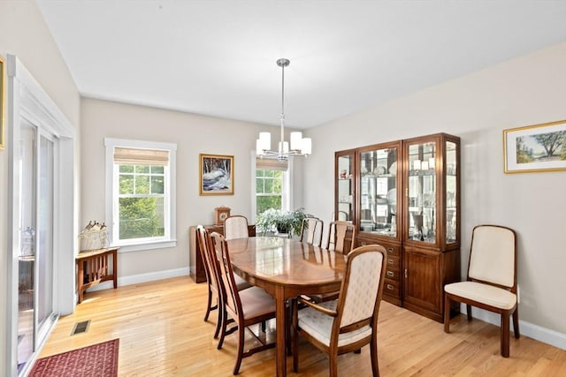 33 Inkberry Ln, Plymouth, MA 02360 - dining area featuring a chandelier, light wood-type flooring, and baseboards