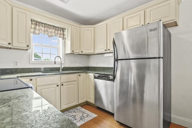 226-236 River St Unit 5, Haverhill, MA 01832 - kitchen featuring stainless steel appliances, a sink, and cream cabinets