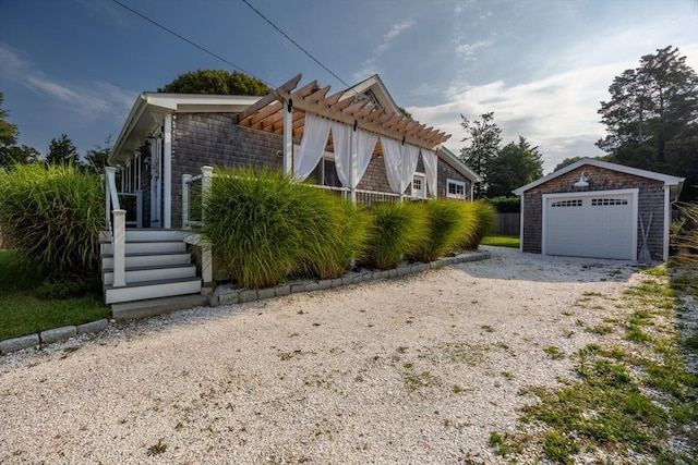 view of property exterior with a garage and an outdoor structure