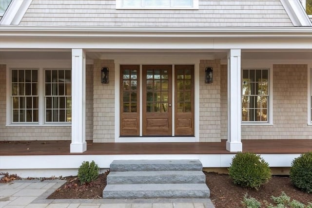 entrance to property featuring covered porch