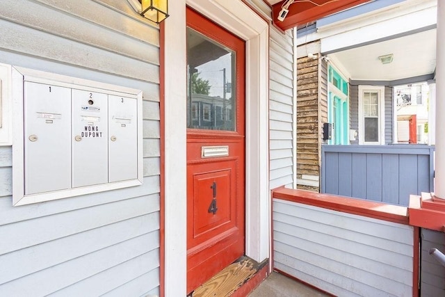 doorway to property featuring covered porch
