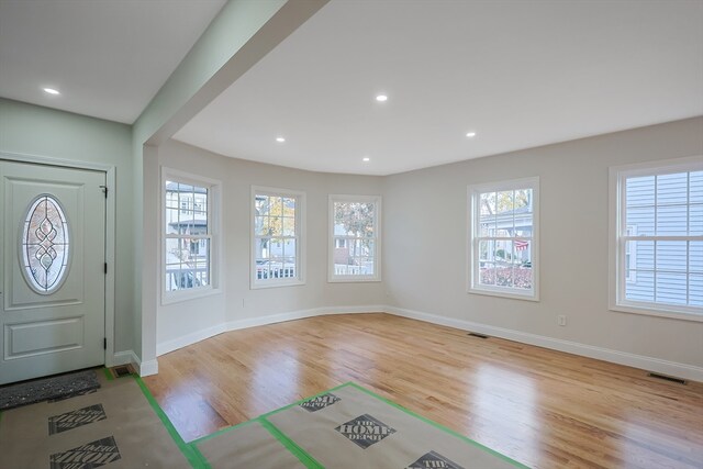 entryway with plenty of natural light and light wood-type flooring