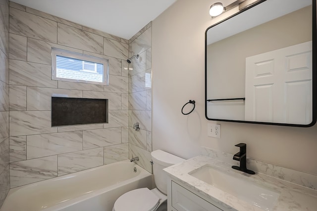 full bathroom with toilet, tiled shower / bath combo, and vanity