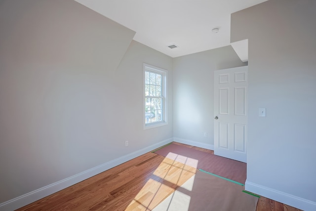 spare room featuring hardwood / wood-style flooring