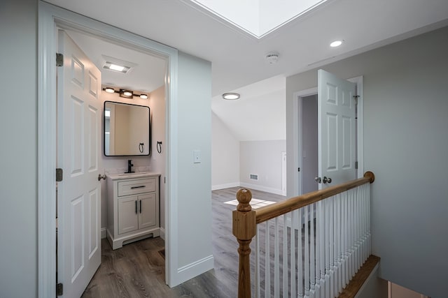 hall with sink and dark hardwood / wood-style flooring