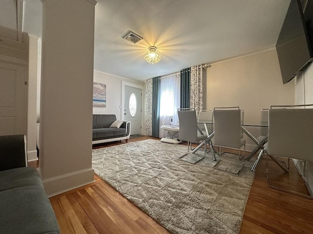 44-46 Spring St, West Springfield, MA 01089 - living room featuring ornamental molding, wood finished floors, baseboards, and a chandelier