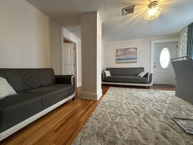 44-46 Spring St, West Springfield, MA 01089 - living room with ornamental molding, wood finished floors, and baseboards