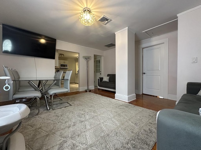 44-46 Spring St, West Springfield, MA 01089 - living area with attic access, wood finished floors, and baseboards