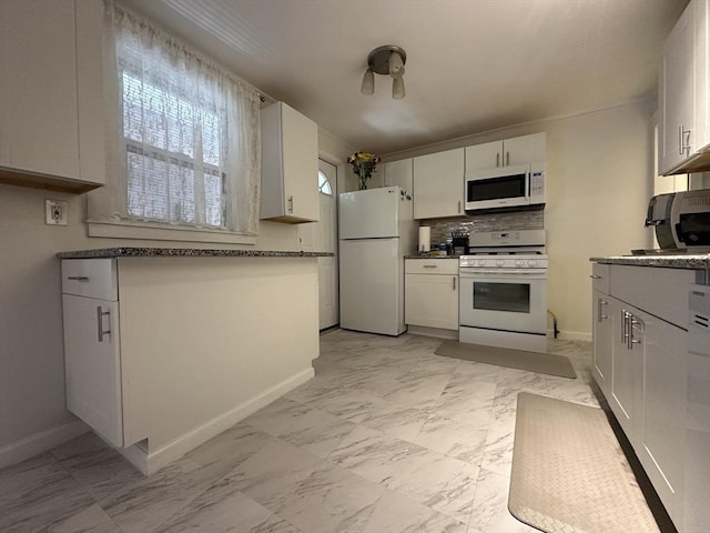 44-46 Spring St, West Springfield, MA 01089 - kitchen with white appliances, light marble finish flooring, backsplash, and baseboards