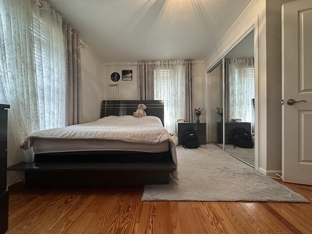 44-46 Spring St, West Springfield, MA 01089 - bedroom featuring ornamental molding, a closet, and wood finished floors
