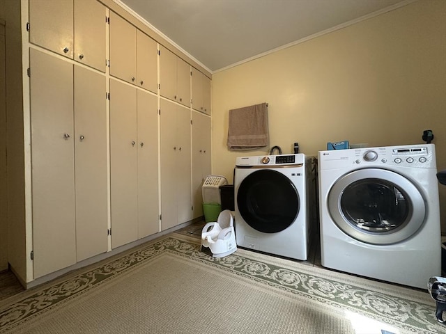 44-46 Spring St, West Springfield, MA 01089 - laundry area featuring cabinet space, ornamental molding, and washing machine and dryer