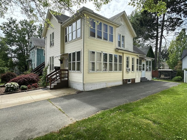44-46 Spring St, West Springfield, MA 01089 - view of home's exterior featuring entry steps, a lawn, cooling unit, and driveway