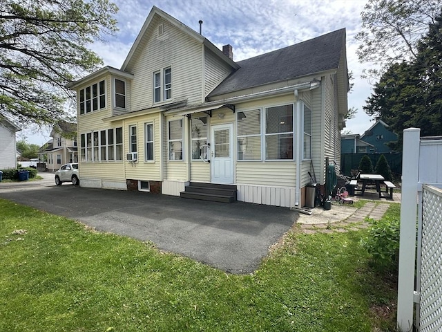 44-46 Spring St, West Springfield, MA 01089 - view of front of home featuring entry steps, a chimney, and cooling unit