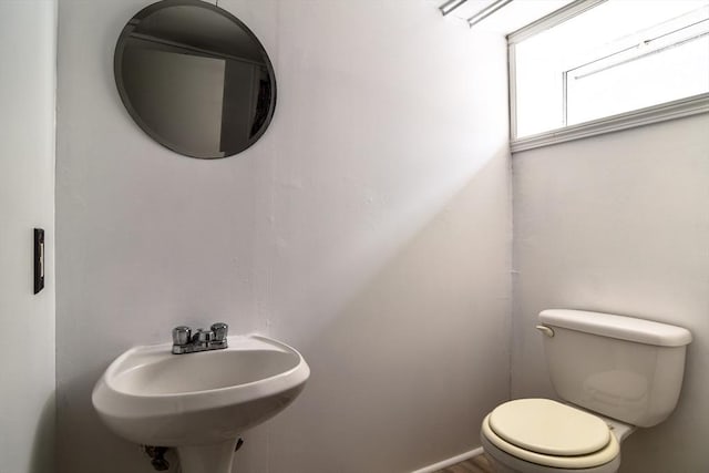 half bath with a sink and toilet