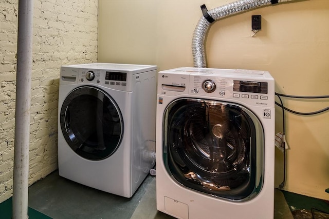 washroom featuring washer and dryer