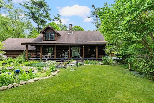 7 Rileys Way, Dartmouth, MA 02747 - back of house featuring a chimney, a yard, log siding, and covered porch