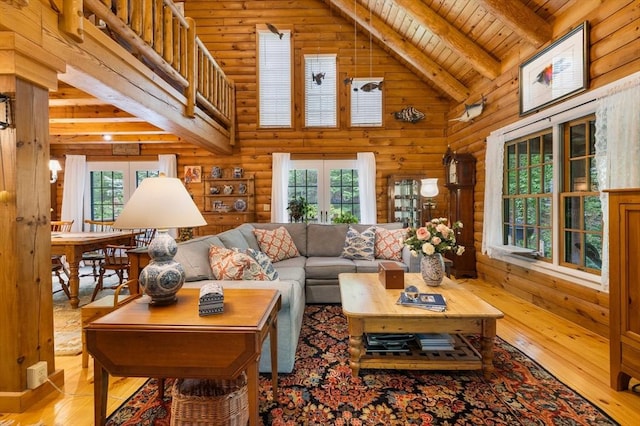 7 Rileys Way, Dartmouth, MA 02747 - living room featuring wood-type flooring, high vaulted ceiling, wooden ceiling with exposed beams, and log walls