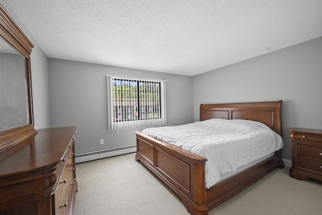 1410 Skyline Dr Unit 11, Lowell, MA 01854 - bedroom with a baseboard heating unit, light colored carpet, and a textured ceiling