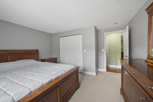 1410 Skyline Dr Unit 11, Lowell, MA 01854 - bedroom with light carpet, a closet, and baseboards