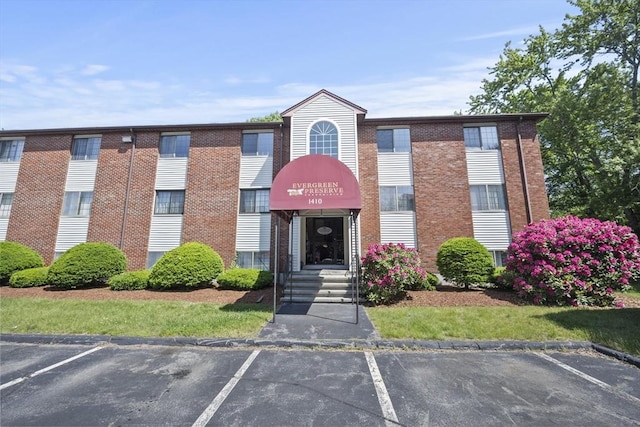 1410 Skyline Dr Unit 11, Lowell, MA 01854 - view of building exterior with uncovered parking