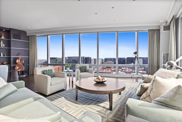 living area with a city view and wood finished floors