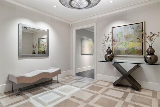 corridor featuring recessed lighting, baseboards, inlaid floor details, and crown molding