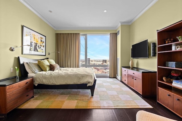 bedroom featuring crown molding, light wood finished floors, and baseboards