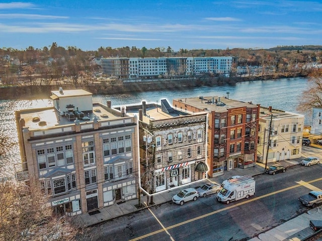 birds eye view of property with a water view