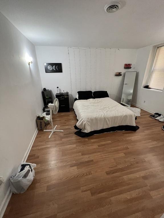 bedroom featuring hardwood / wood-style flooring