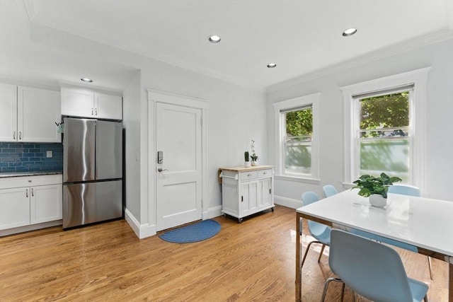 200 Winchester St Unit 1, Brookline, MA 02446 - dining area with light wood-style flooring, crown molding, recessed lighting, and baseboards