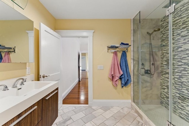 200 Winchester St Unit 1, Brookline, MA 02446 - bathroom featuring a stall shower, vanity, baseboards, and marble finish floors