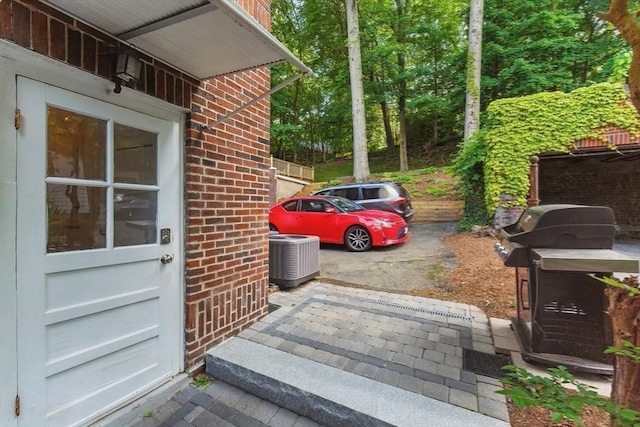 200 Winchester St Unit 1, Brookline, MA 02446 - property entrance with brick siding and central AC unit