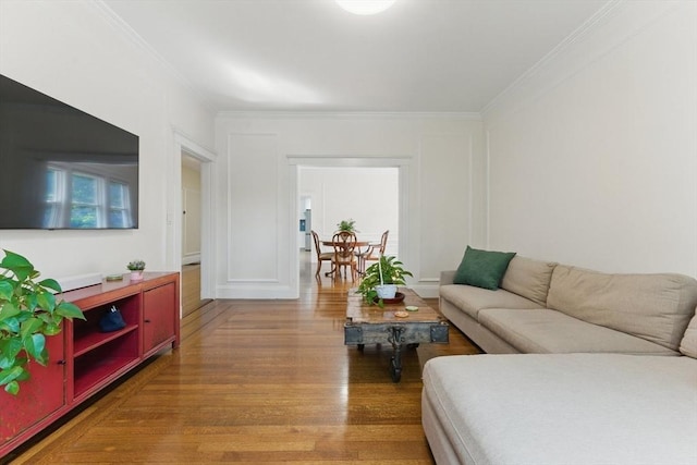 200 Winchester St Unit 1, Brookline, MA 02446 - living area with wood finished floors, crown molding, and a decorative wall