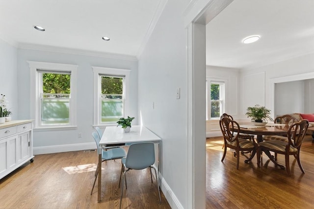 200 Winchester St Unit 1, Brookline, MA 02446 - dining area featuring crown molding, wood finished floors, healthy amount of natural light, and baseboards