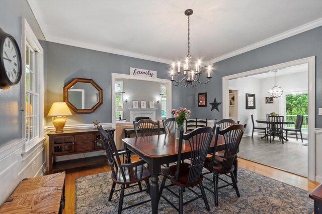 28 Sandy Ridge Rd, Sterling, MA 01564 - dining room with a chandelier, wood finished floors, ornamental molding, and a fireplace