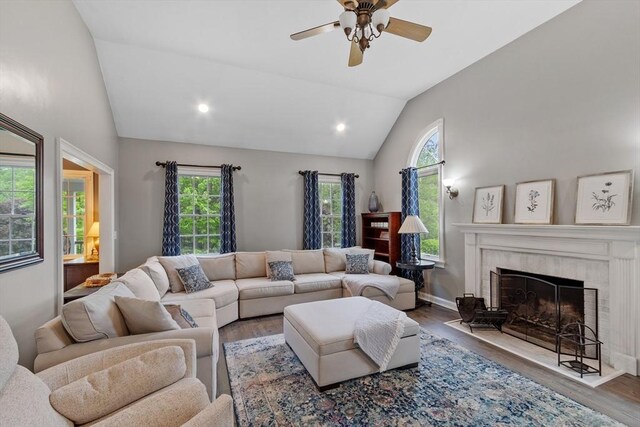 28 Sandy Ridge Rd, Sterling, MA 01564 - living room featuring vaulted ceiling, wood finished floors, a ceiling fan, a tiled fireplace, and recessed lighting