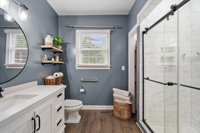 28 Sandy Ridge Rd, Sterling, MA 01564 - bathroom featuring a shower stall, vanity, toilet, and wood finished floors