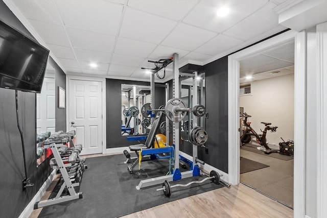 28 Sandy Ridge Rd, Sterling, MA 01564 - workout area featuring a drop ceiling, wood finished floors, and baseboards