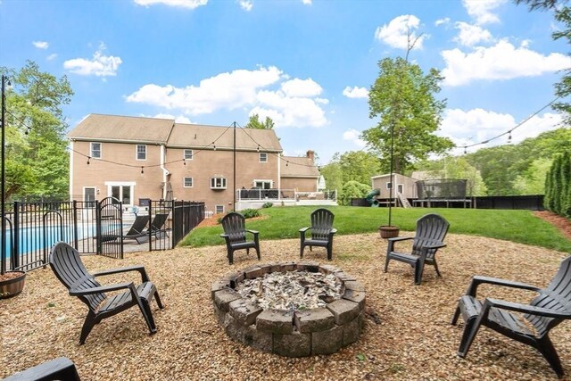 28 Sandy Ridge Rd, Sterling, MA 01564 - view of yard featuring an outdoor fire pit and a trampoline