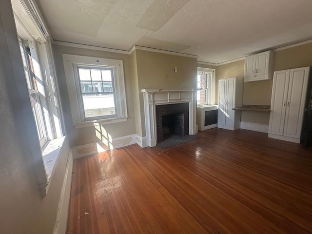 91-93 Mulberry St, Springfield, MA 01105 - unfurnished living room with baseboards, a wealth of natural light, a fireplace, and hardwood / wood-style flooring