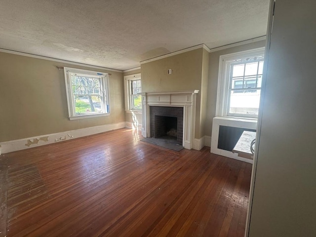 91-93 Mulberry St, Springfield, MA 01105 - unfurnished living room with crown molding, a textured ceiling, a fireplace, and hardwood / wood-style floors