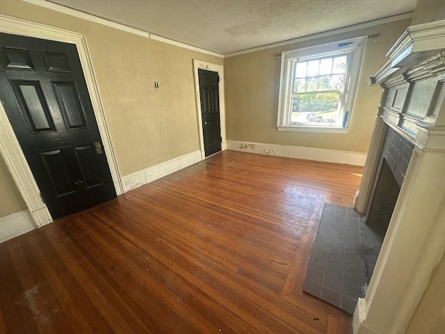 91-93 Mulberry St, Springfield, MA 01105 - unfurnished living room featuring crown molding, a textured ceiling, baseboards, a fireplace with flush hearth, and wood finished floors