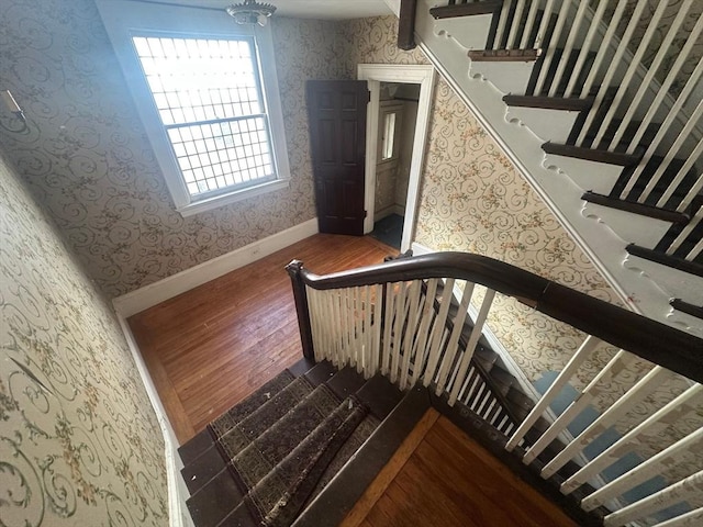 91-93 Mulberry St, Springfield, MA 01105 - stairway with baseboards, wood finished floors, and wallpapered walls