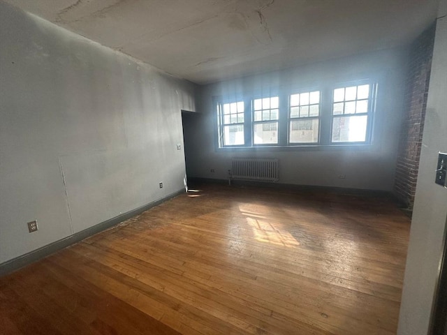 91-93 Mulberry St, Springfield, MA 01105 - spare room featuring hardwood / wood-style flooring and radiator