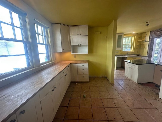 91-93 Mulberry St, Springfield, MA 01105 - kitchen with a sink, white cabinetry, tile patterned floors, and a healthy amount of sunlight