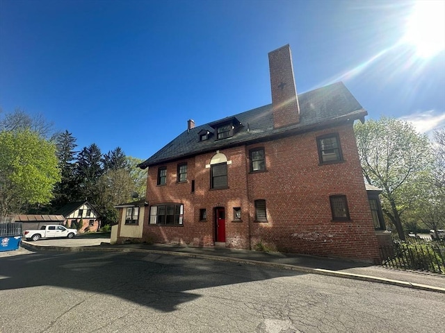 91-93 Mulberry St, Springfield, MA 01105 - rear view of house with brick siding and a chimney