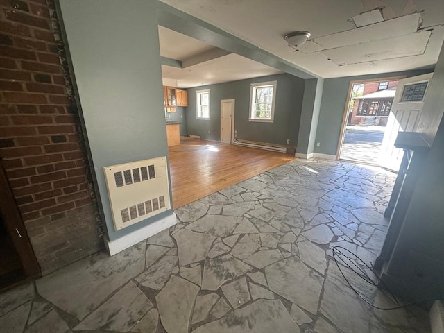 91-93 Mulberry St, Springfield, MA 01105 - unfurnished room with heating unit, baseboards, a baseboard radiator, and stone flooring