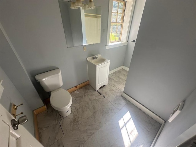 91-93 Mulberry St, Springfield, MA 01105 - bathroom with baseboards, vanity, toilet, and marble finish floor
